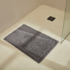 Charcoal Plush Bath Mat On Floor