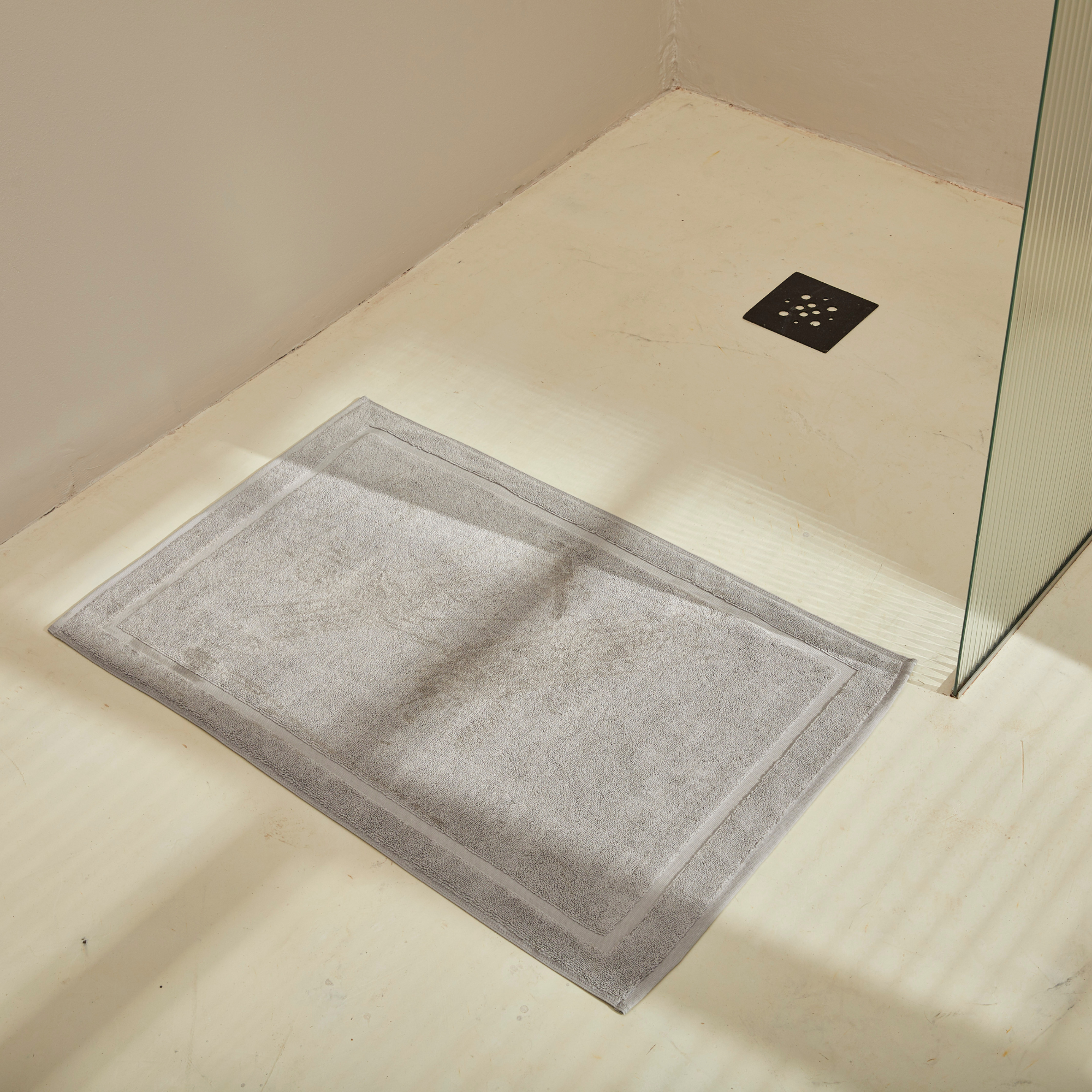 Grey Plush Bath Mat On Floor